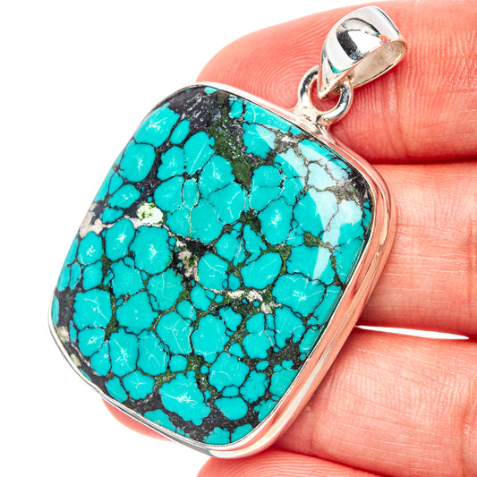 Turquoise stone pendant in .925 sterling silver bezel with top loop bail