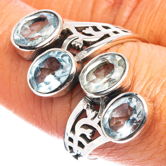 Sterling silver oval blue topaz ring with 4 faceted stones, ornate openwork setting