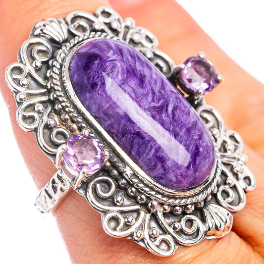 Oval purple gemstone cabochon ring, ornate sterling silver filigree with 3 purple accents
