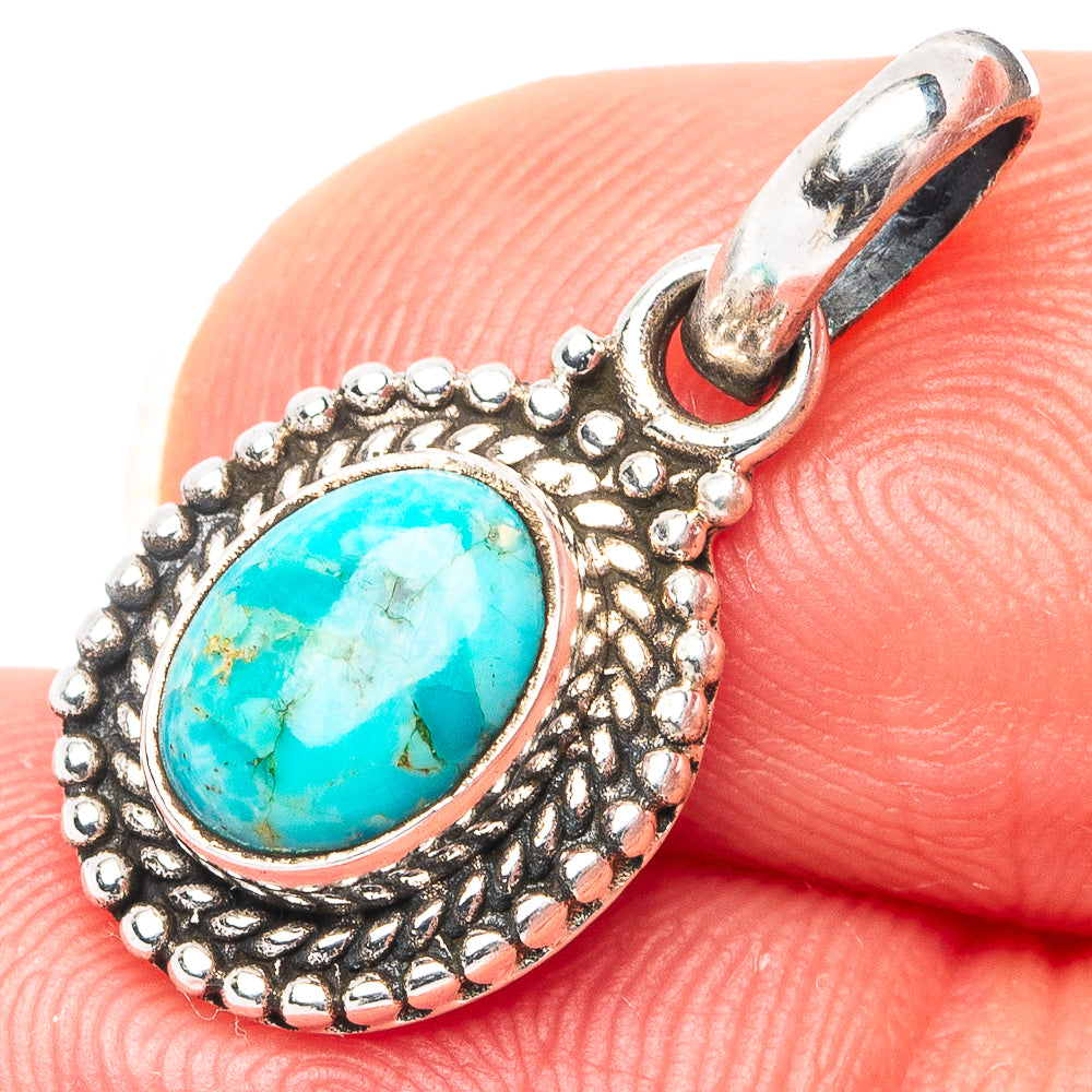 Turquoise oval pendant in .925 sterling silver with textured bezel and bail