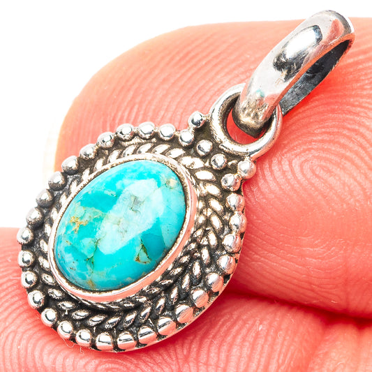 Turquoise oval pendant in .925 sterling silver with textured bezel and bail