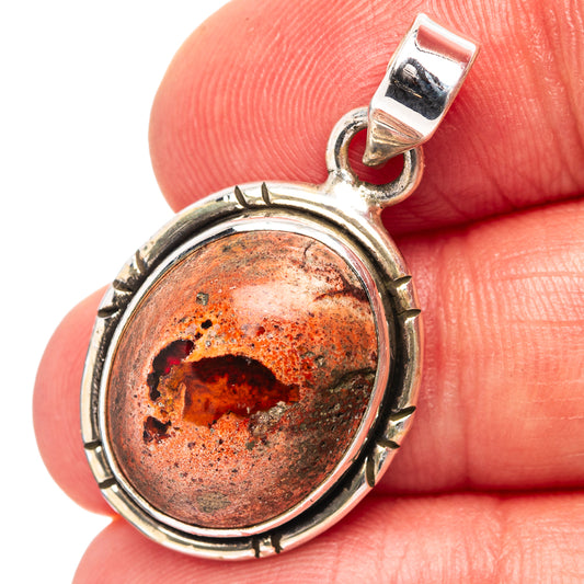 Sterling silver fire opal pendant with oval red-orange gemstone bezel