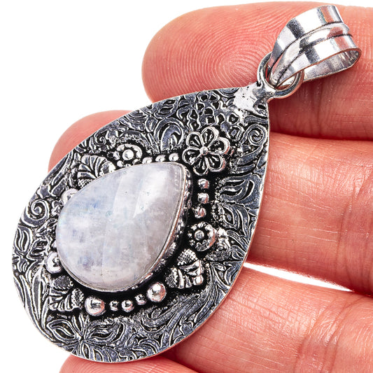 Teardrop moonstone pendant in German silver with ornate filigree and light lavender cabochon