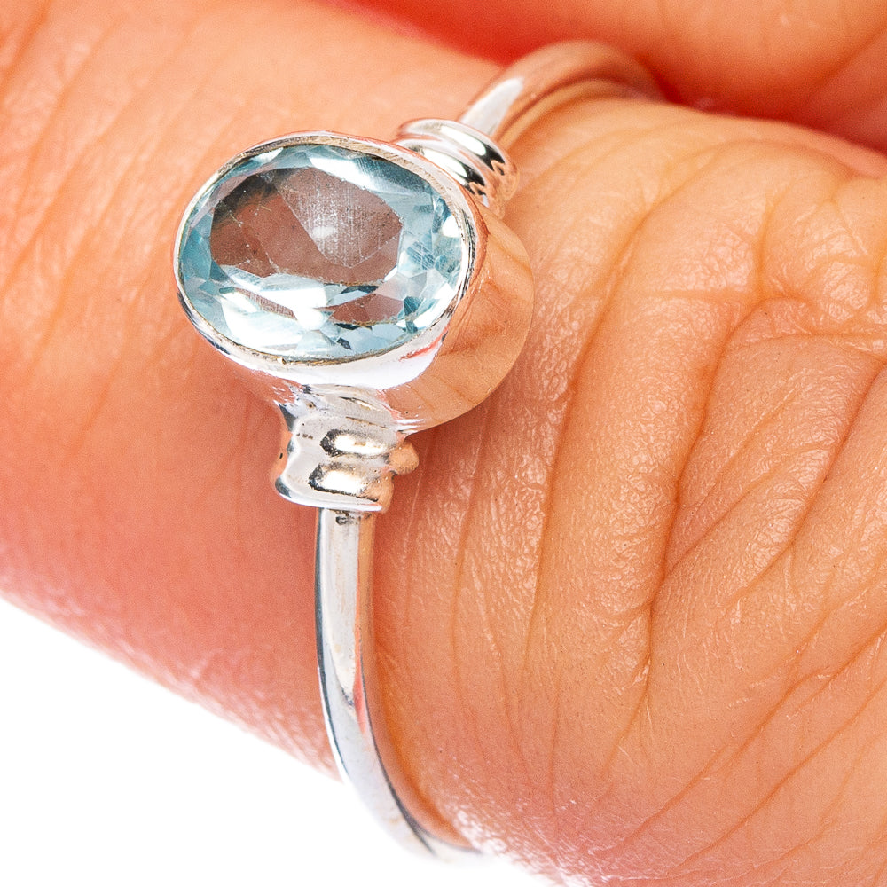 925 sterling silver ring with oval sky-blue topaz stone, worn on finger