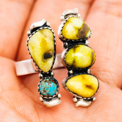 Adjustable .925 sterling silver ring with two oval yellow stones and turquoise drop dangle
