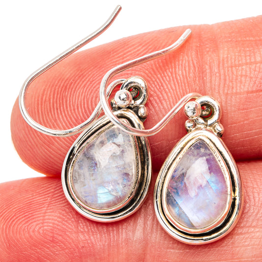 Sterling silver teardrop moonstone earrings with iridescent blue-purple glow, hook back