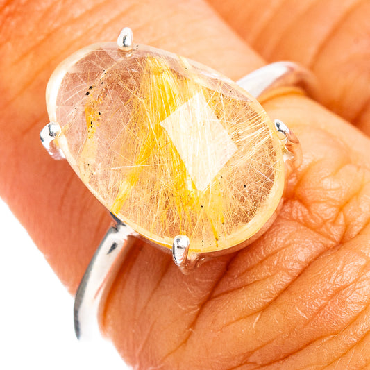 Faceted rutilated quartz oval ring in .925 sterling silver with four prong settings