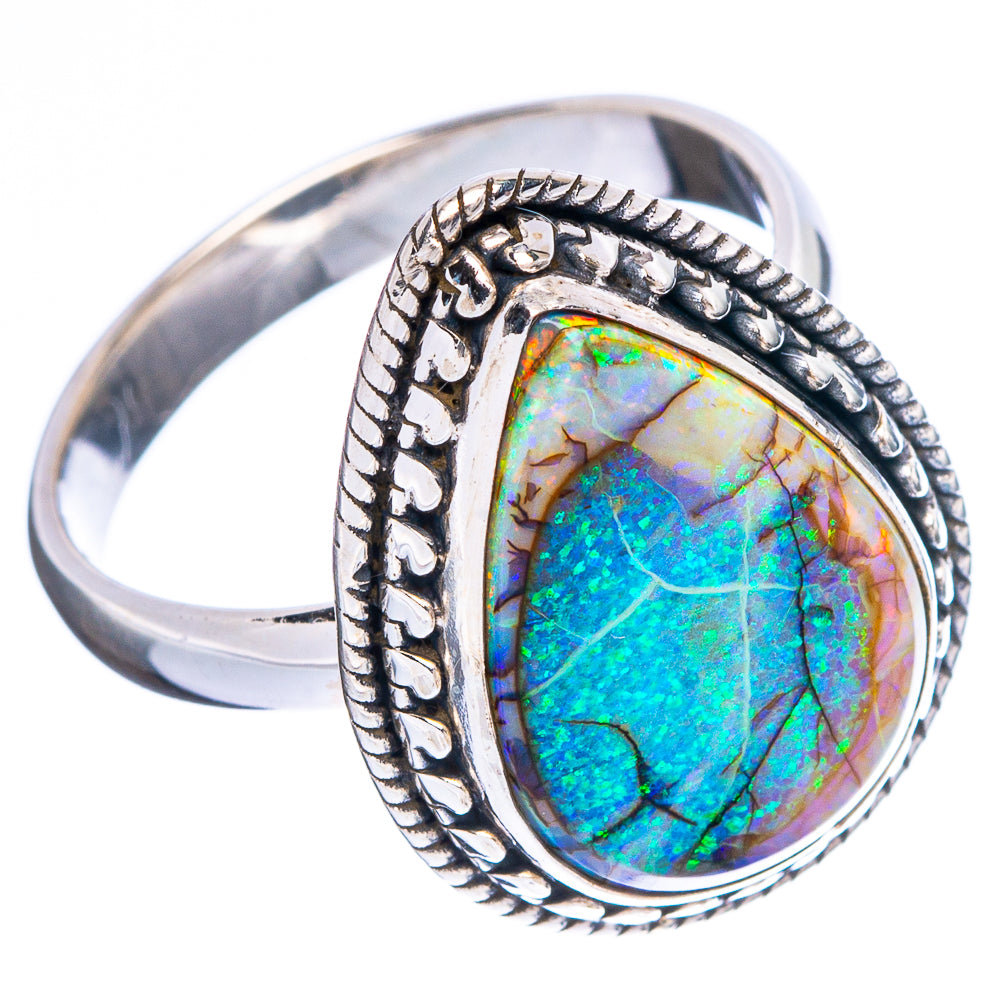 Sterling silver oval opal ring, side view; ornate bezel with bright blue-green stone