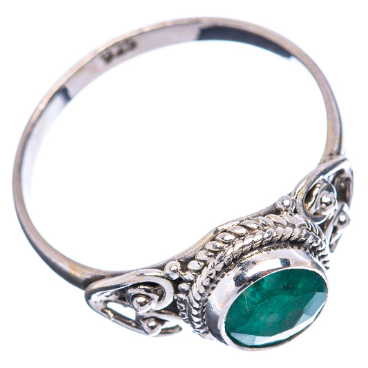 Sterling silver ring featuring green oval gemstone and braided detail on the band