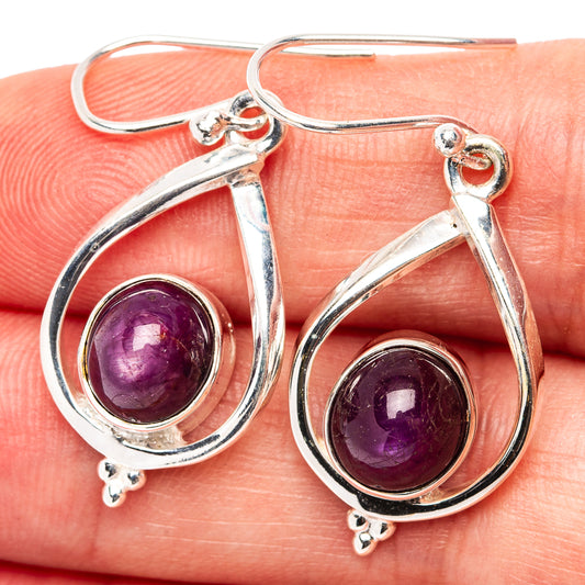 Sterling silver star ruby drop earrings with round purple cabochon and teardrop frames