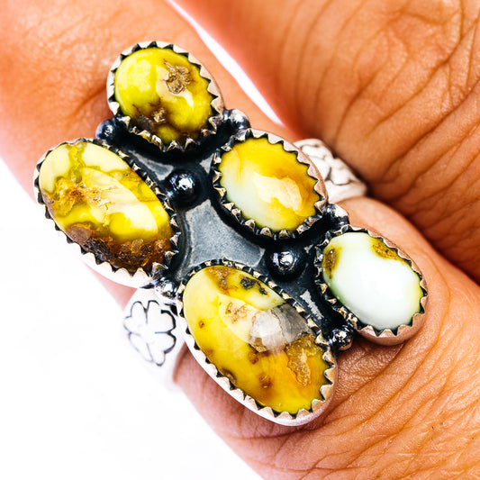 Adjustable sterling silver ring with black settings and yellow oval gemstone clusters
