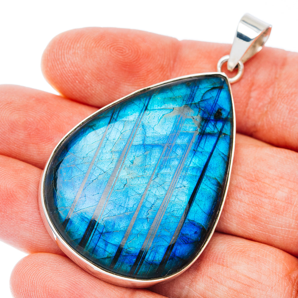 Sterling silver teardrop pendant with blue spectrolite gemstone