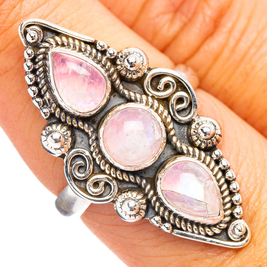 Sterling silver ring with three pink teardrop moonstone settings and ornate beadwork