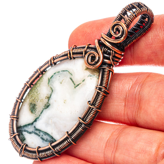 Oxidized copper wire-wrapped agate pendant with green moss stone slice