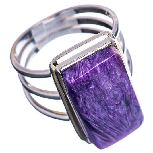 Sterling silver ring with rectangular purple gemstone setting, open-frame shank