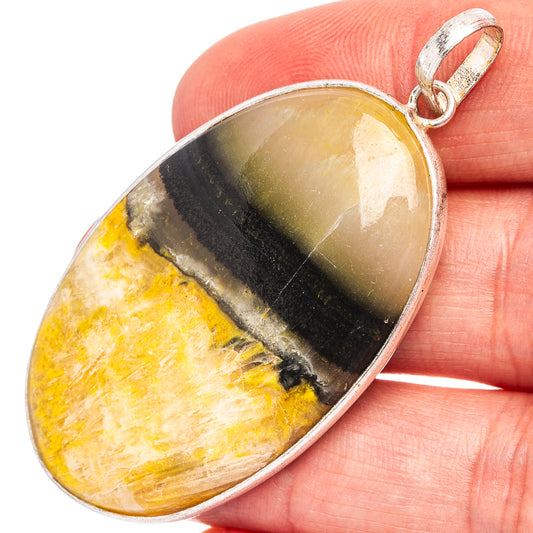 Bumblebee jasper pendant with oval yellow stone and dark bands, silver-plated bail