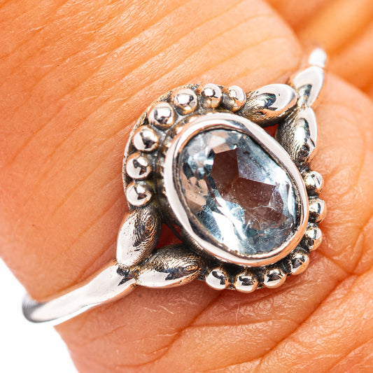 Blue topaz oval sterling silver ring with beaded halo and leaf prongs