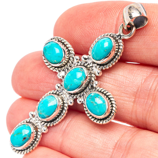 Sterling silver turquoise cross pendant with oval blue stones in ornate settings