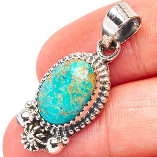 Turquoise stone pendant with .925 sterling silver frame and loop bail, ornate side details