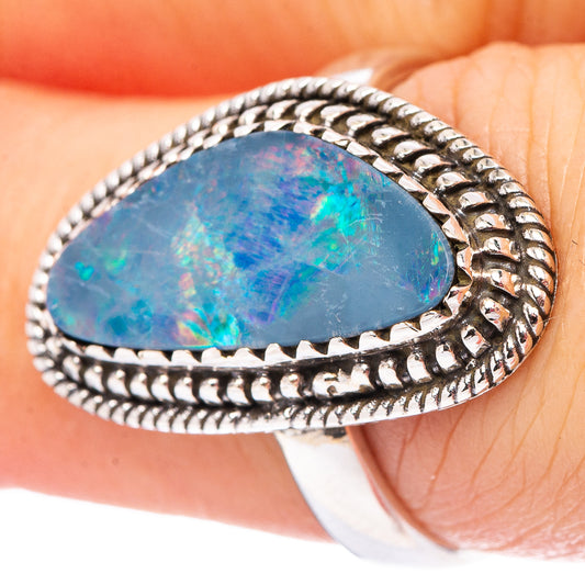 Sterling silver oval opal doublet ring with beaded rope border, blue iridescent stone