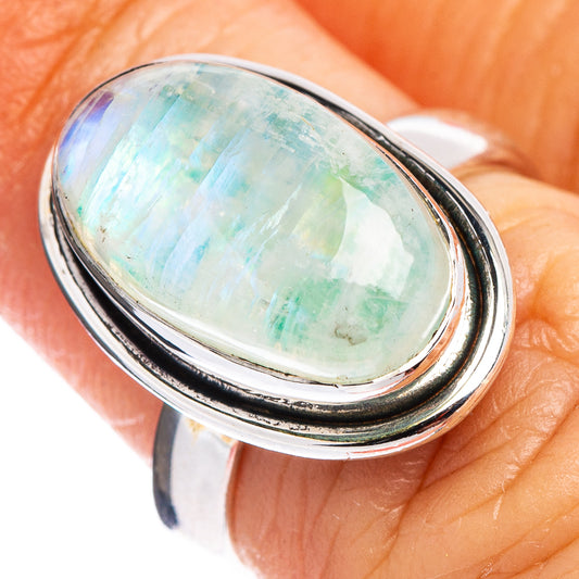 Sterling silver moonstone ring with oval green-blue iridescent cabochon, close-up