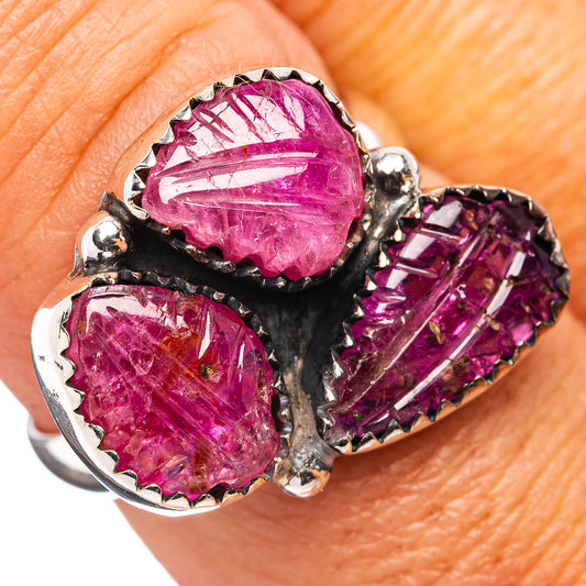 Sterling silver ring with three carved magenta red ruby gemstones and scalloped settings