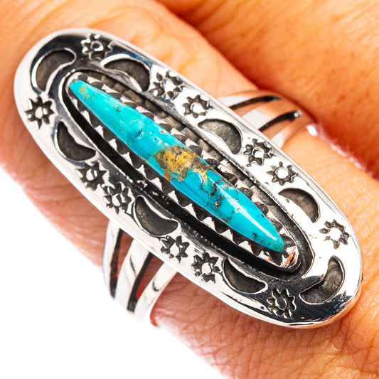 Turquoise oval cabochon sterling silver ring with ornate black inlay details