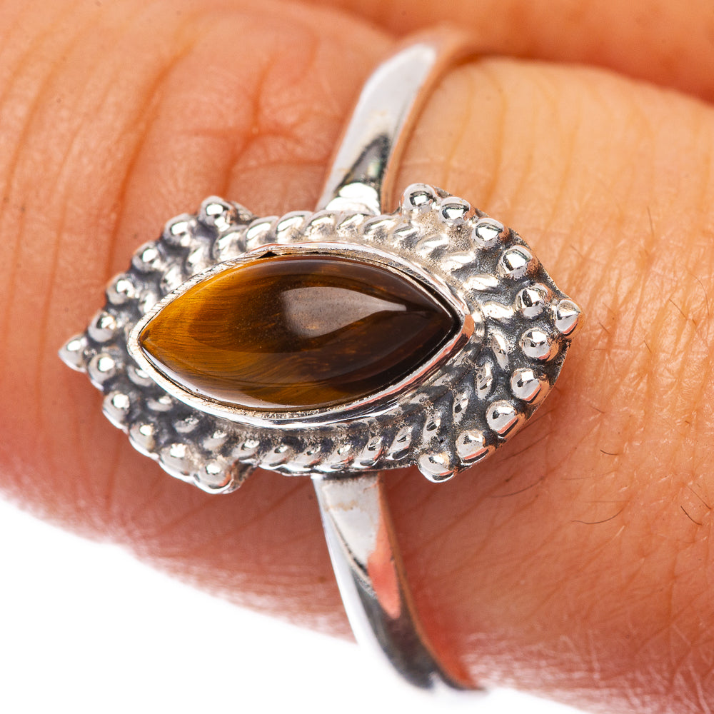 Sterling silver ring with oval tiger eye cabochon, textured bezel, size 9.5