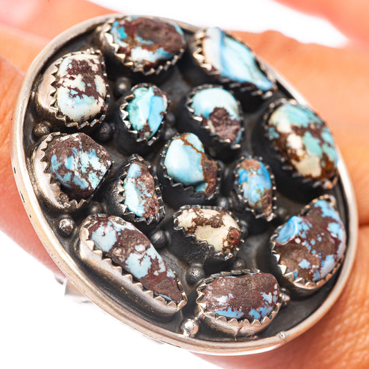 Sterling silver ring with oval turquoise cabochons in dark bezel setting