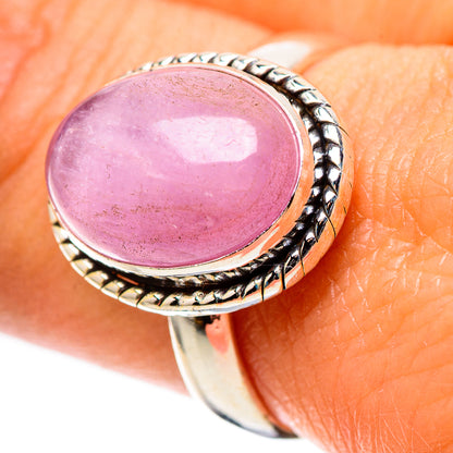 Kunzite ring size 9 with oval lavender-pink cabochon and engraved silver surround