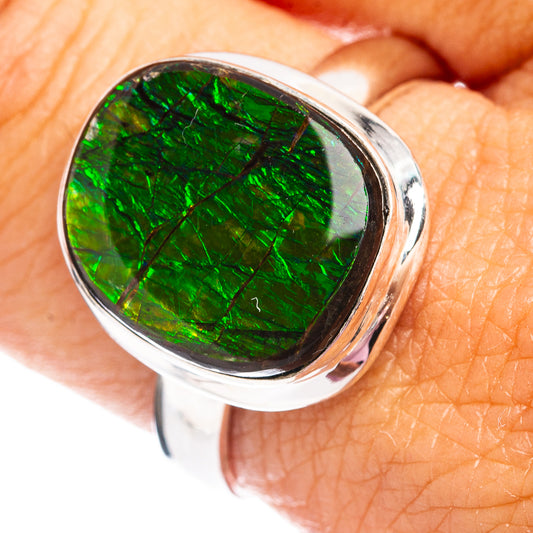 Oval green ammolite gemstone ring in polished .925 sterling silver bezel