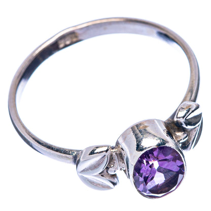 Sterling silver ring with faceted oval amethyst and decorative band twists