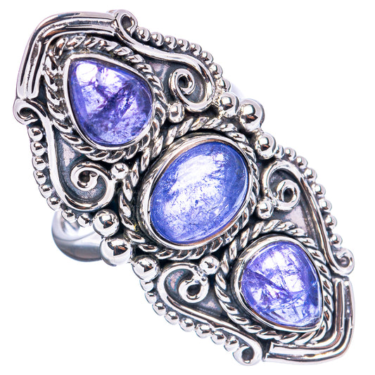Sterling silver ring featuring three oval blue gemstones with filigree border