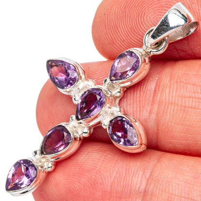 Sterling silver cross pendant with five faceted amethyst teardrop stones, close-up