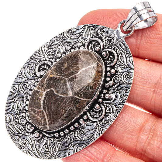 Fossil coral cabochon pendant, ornate oval filigree and bail, German silver