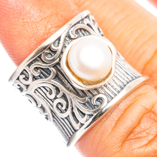 Sterling silver ring with ornate filigree and round cultured pearl top