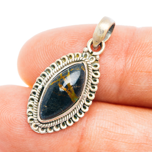 Sterling silver pendant with blue-green teardrop stone and ornate bezel frame