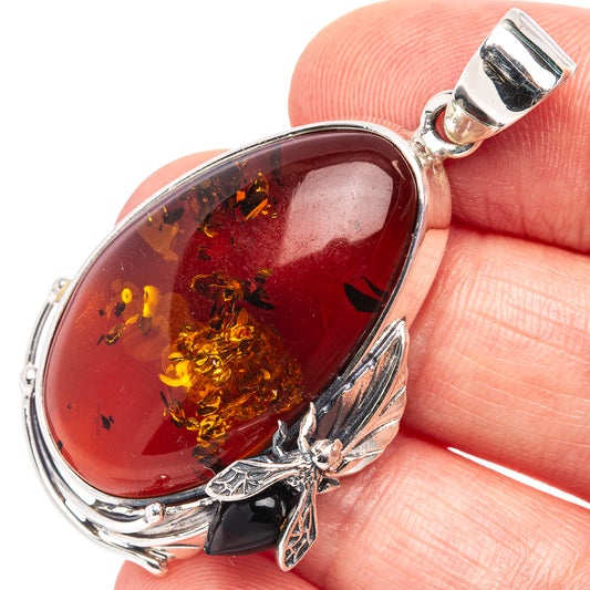 Teardrop Baltic Amber bee pendant in .925 sterling silver, oval bezel and bail