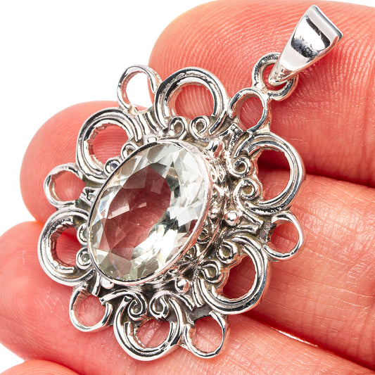 Faceted clear oval stone pendant with filigree .925 sterling silver setting and clasp bail