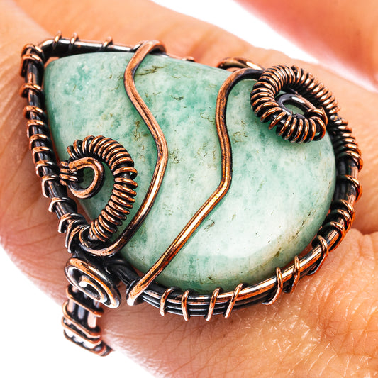 Oxidized copper wire wrap ring with oval turquoise stone and spiral wire details