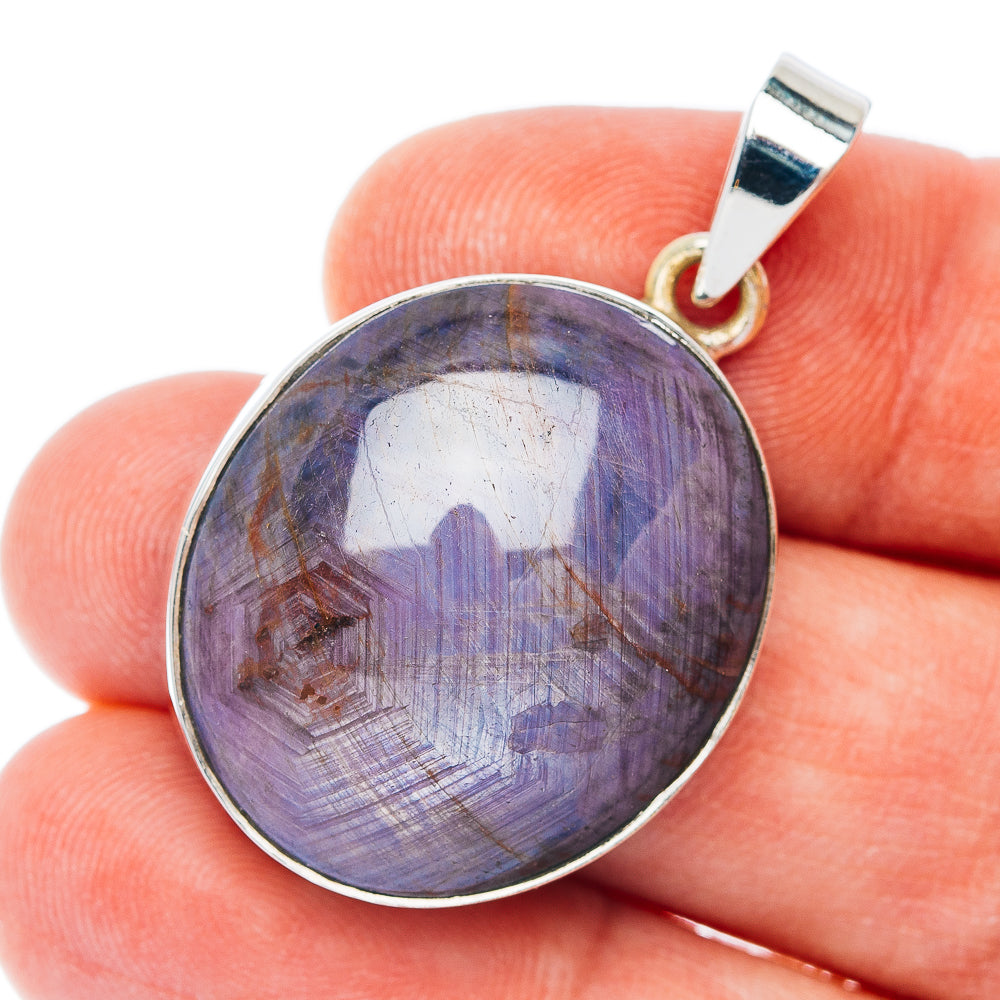 Round sterling silver gemstone pendant with purple starry cabochon