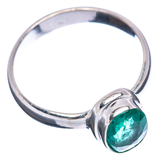 Sterling silver ring with oval green emerald, side view