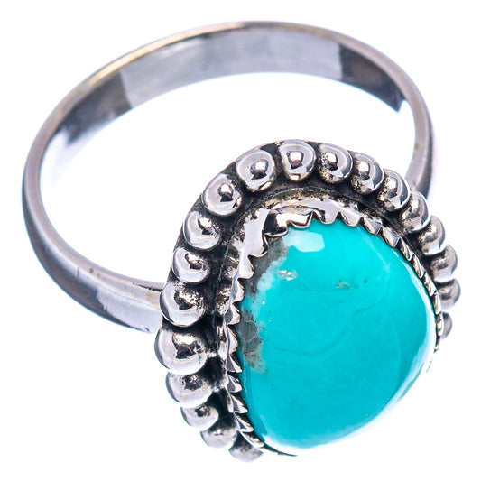 Turquoise cabochon silver ring with scalloped bead setting, open profile