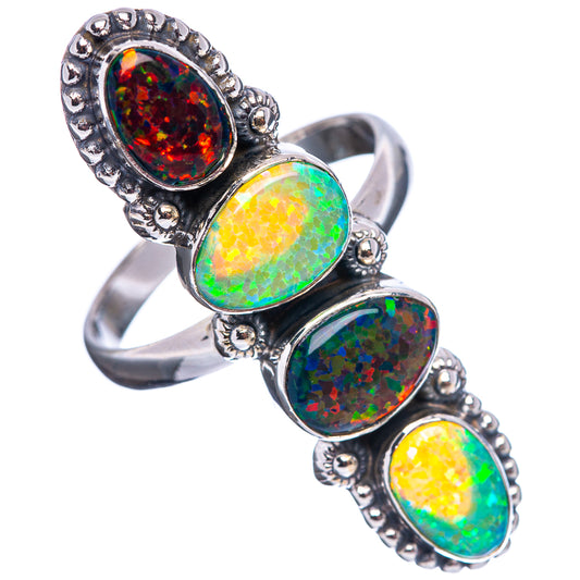 Bezel-set oval synthetic opal ring with three stones on a silver-tone band (size 11)