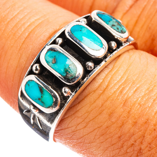 Sterling silver turquoise ring with three oval cabochon stones on a wide band