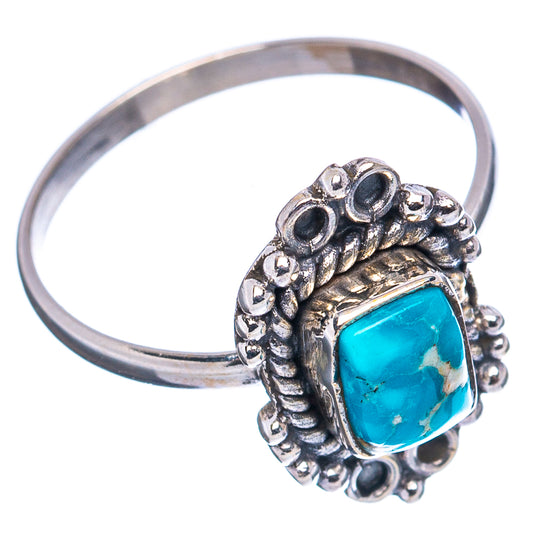 Turquoise cabochon sterling silver ring with decorative oval beadwork side setting
