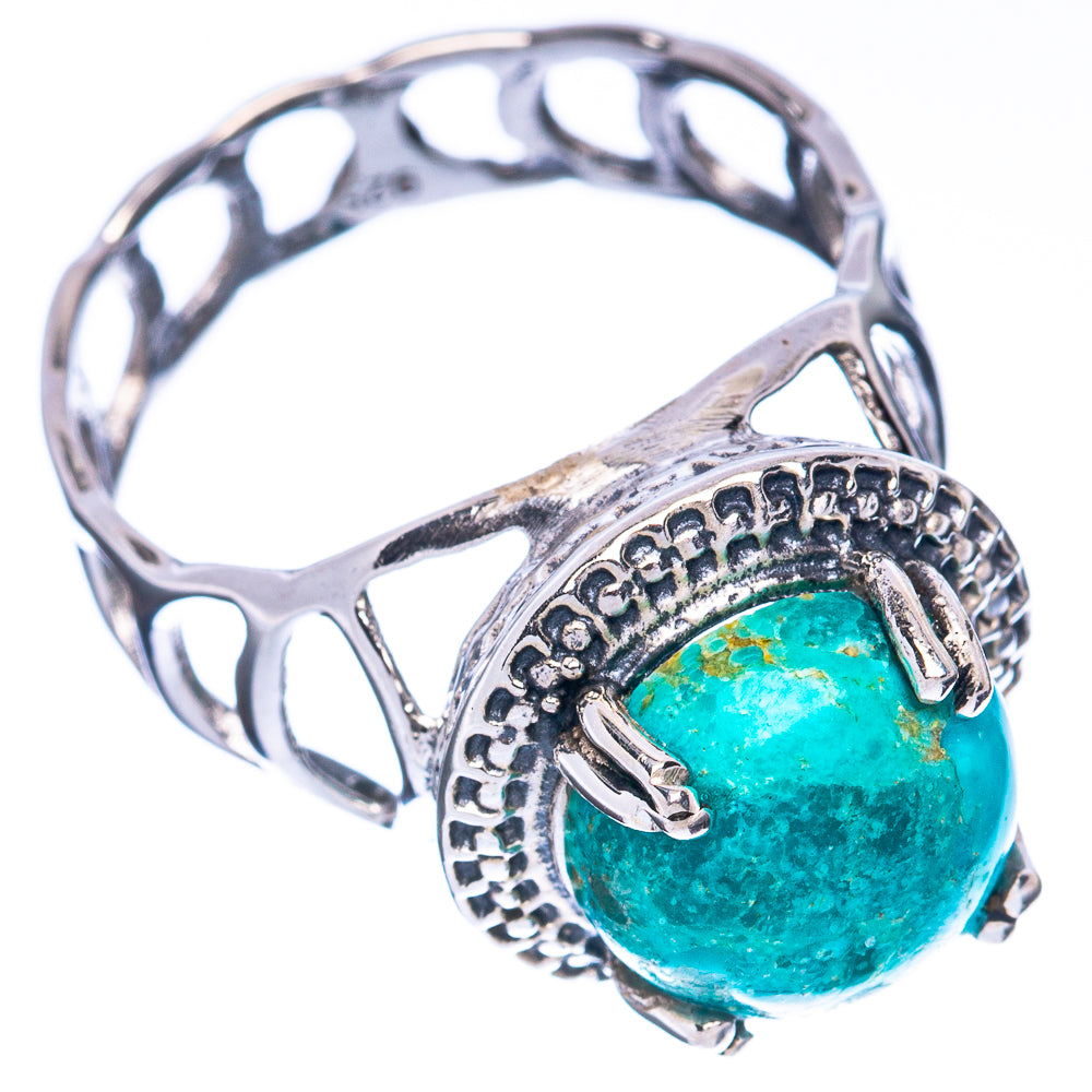 Sterling silver turquoise cabochon ring with openwork shank and detailed side setting