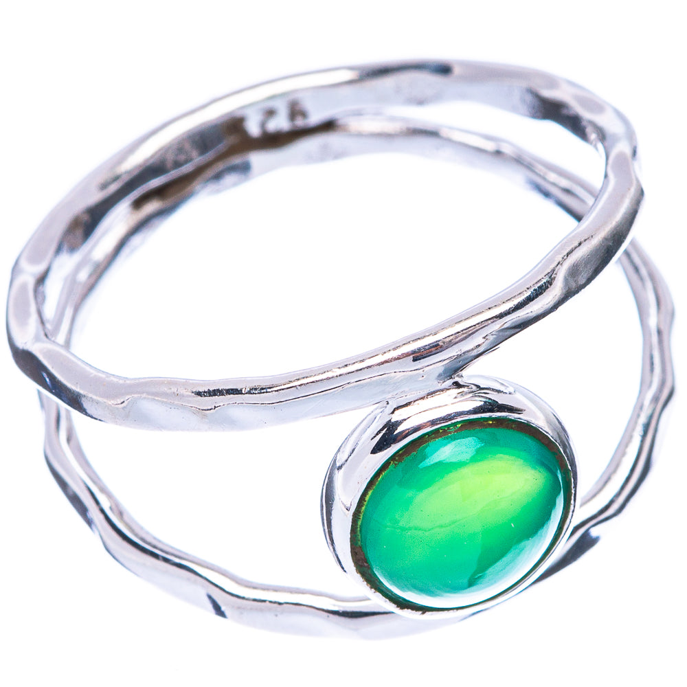 Silver swirl ring with oval green onyx bezel, green stone centered