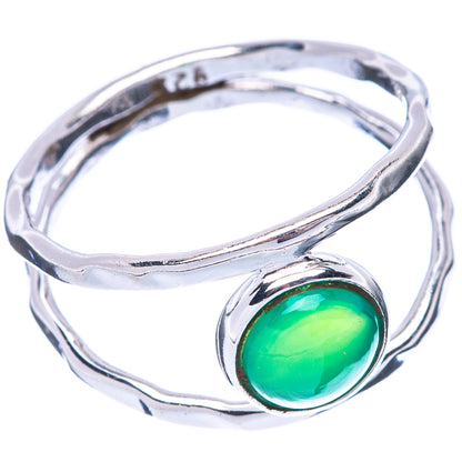 Silver swirl ring with oval green onyx bezel, green stone centered