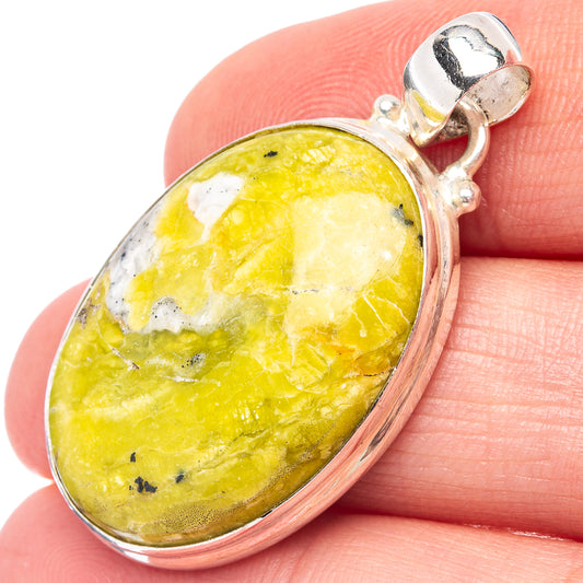 Oval yellow lizardite cabochon pendant in .925 sterling silver bezel with bail